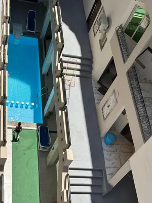 an overhead view of a building with a pool at Arabia Sea View in Hurghada