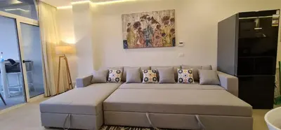 a living room with a large couch in a room at The dune Terrace in Hurghada