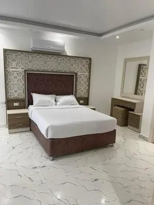 a bedroom with a large bed in a room at live in luxury hotel-style apartment in the heart of the city in Hurghada