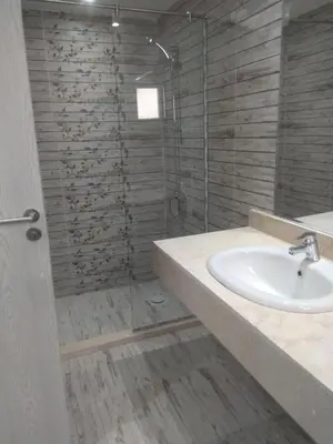 a bathroom with a shower and a sink and a shower at live in luxury hotel-style apartment in the heart of the city in Hurghada