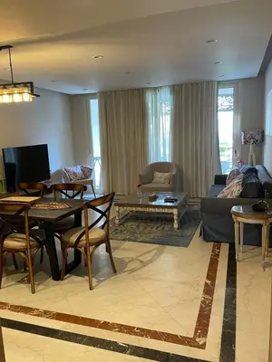 a living room with a couch and a table at Apartment in El gouna mangrouovy in Hurghada