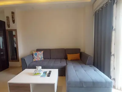 a living room with a couch and a table at 2 bed Flat, Hurghada, long&short in Hurghada