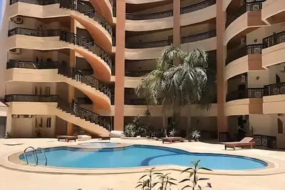 a rendering of an apartment building with a swimming pool at Regency towers résidence in Hurghada