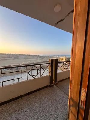 a view of the ocean from a balcony at Unique Studio Free access beach in Hurghada