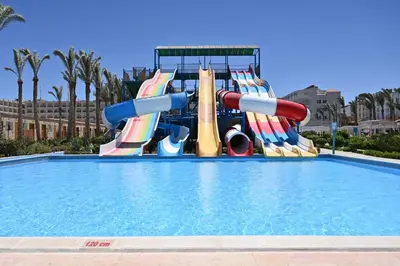 a water slide in a swimming pool at Riviera Aqua Park Resort in Hurghada