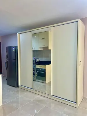 a kitchen with sliding glass doors and a refrigerator at Apartment with private beach 09E in Hurghada