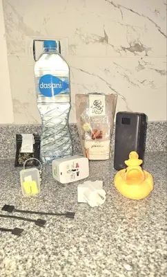 a bottle of water and a cell phone on a counter at Marina Bay Elegance Room Balcony Overlooking Luxury Yachts in Hurghada