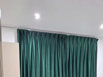 a green curtain in a room at Marina Bay Elegance Room Balcony Overlooking Luxury Yachts in Hurghada