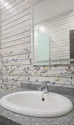 a white sink in a bathroom with a mirror at Marina Bay Elegance Room Balcony Overlooking Luxury Yachts in Hurghada