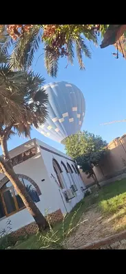 a hot air balloon in front of a building at Desert Rose apartments in Luxor