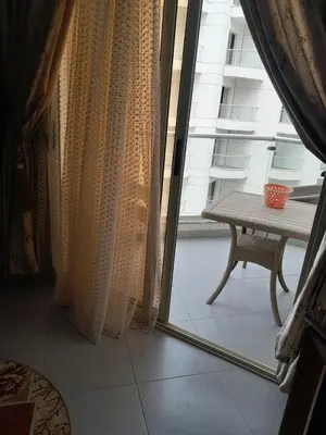 a room with a window with a table and a table at شالية منتجع سكانديك عرابيا in Hurghada