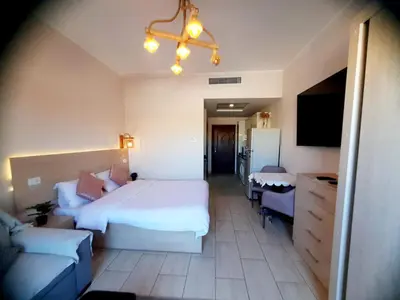 a hotel room with a bed and a couch at Units for rent in Hurghada in Hurghada