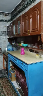 a kitchen counter with a pink item on top of it at Souzan house in Luxor