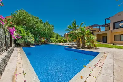 a swimming pool in front of a house at Townhouse South Marina in Hurghada