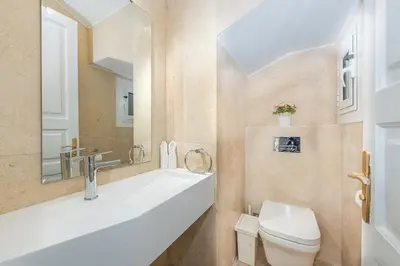 a bathroom with a toilet and a sink at Townhouse South Marina in Hurghada