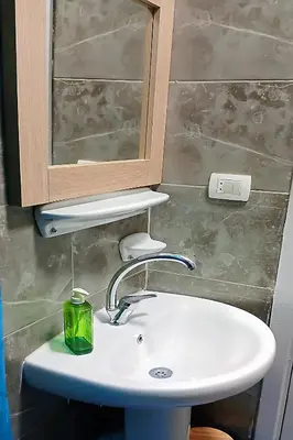 a bathroom sink with a medicine cabinet and a mirror at One bedroom apartment with a hall in Aqua Infinity Resort before El Gouna in Hurghada