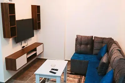 a living room with a couch and a table at One bedroom apartment with a hall in Aqua Infinity Resort before El Gouna in Hurghada