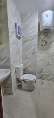 a bathroom with a toilet and a sink at Tiba Golden Red Sea Coral Hurghada in Hurghada