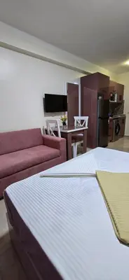 a living room with a bed and a couch at Tiba Golden Sun-kissed Hurghada in Hurghada