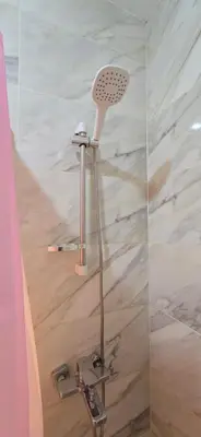 a shower with a blow dryer in a bathroom at Tiba Golden Sun-kissed Hurghada in Hurghada