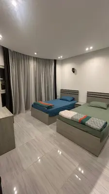 a bedroom with two beds in a room at Flat In Elhambra in Hurghada