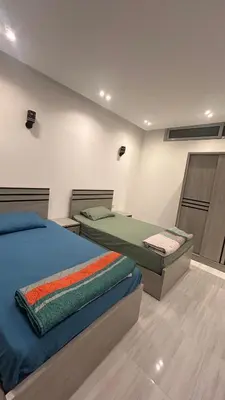 a bedroom with two beds in a room at Flat In Elhambra in Hurghada
