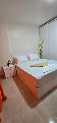 a bedroom with a large bed with a glass wall at Tiba Golden White Lagoon Hurghada in Hurghada