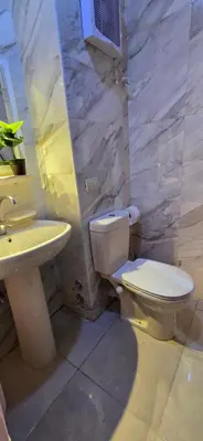a bathroom with a toilet and a sink at Tiba Golden White Lagoon Hurghada in Hurghada
