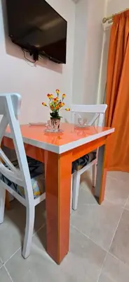 a table with a vase of flowers on top of it at Tiba Golden White Lagoon Hurghada in Hurghada