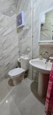 a bathroom with a toilet and a sink at Tiba Golden Whire Sands Hurghada in Hurghada