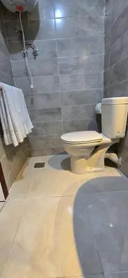 a bathroom with a toilet and a shower at Tiba Golden Blue Oasis Hurghada in Hurghada