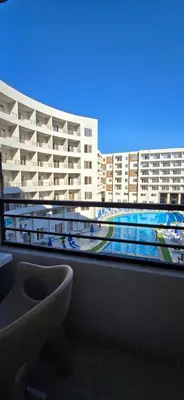 a bathroom with a view of a large building at Tiba Golden Crystal Water Hurghada in Hurghada