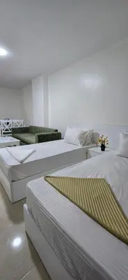a room with three beds in a room at Tiba Golden Crystal Water Hurghada in Hurghada