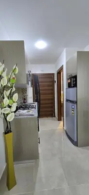 a kitchen with a stove and a counter top at Tiba Golden Crystal Water Hurghada in Hurghada