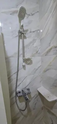 a shower with a blow dryer in a bathroom at Tiba Golden Sea Harmony Hurghada in Hurghada