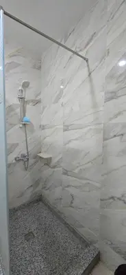 a shower with a glass door in a bathroom at Tiba Golden Sun and Sea Hurghada in Hurghada