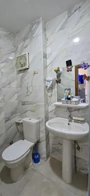 a bathroom with a toilet and a sink at Tiba Golden Sun and Sea Hurghada in Hurghada