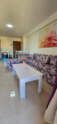 a living room with a white table and a couch at Tiba Golden Sand Palace Hurghada in Hurghada