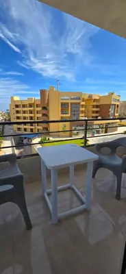 a white table sitting on top of a roof at Tiba Golden Oasis Royale Hurghada in Hurghada