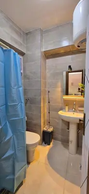 a bathroom with a toilet and a sink at Tiba Golden Blue Mirage Hurghada in Hurghada