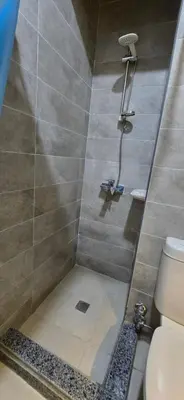 a bathroom with a shower with a toilet at Tiba Golden Blue Mirage Hurghada in Hurghada