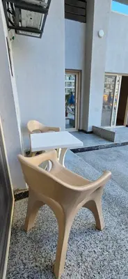 two chairs and a table in a building at Tiba Golden Blue Mirage Hurghada in Hurghada