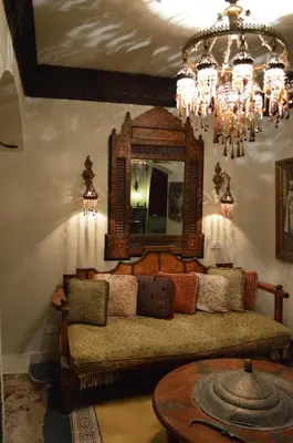 a living room with a couch and a mirror at El Gouna 4 Bedroom 4 Bathroom Lagoon villa in Banī Ghālib