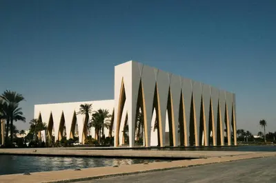 a large white building with trees in front of it at El Gouna 4 Bedroom 4 Bathroom Lagoon villa in Banī Ghālib