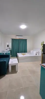a living room with a bed and a couch at Tiba Golden Palm Hurghada in Hurghada