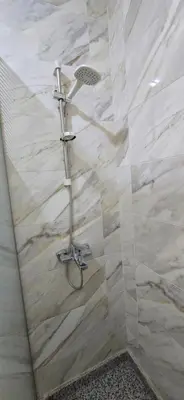 a shower with a glass door in a bathroom at Tiba Golden Azure Coast Hurghada in Hurghada