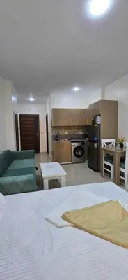 a large living room with a bed and a kitchen at Tiba Golden Aqua Vista Hurghada in Hurghada