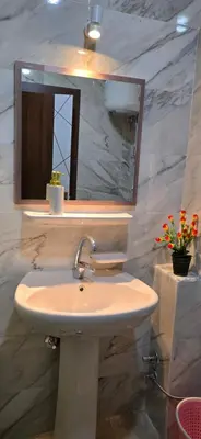 a bathroom with a sink and a mirror at Tiba Golden Beach View Hurghada in Hurghada