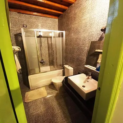 a bathroom with a toilet and a sink at Villa Karmen in Luxor