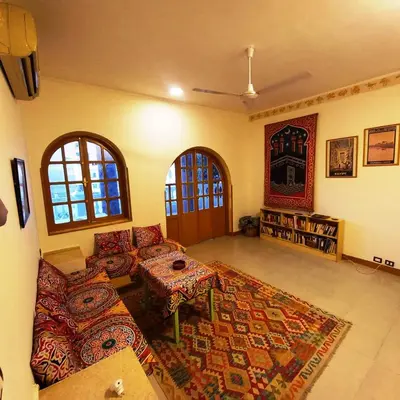 a living room with a couch and a table at Villa Karmen in Luxor